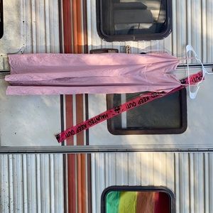 It is a size small jump shut it is a light pink color